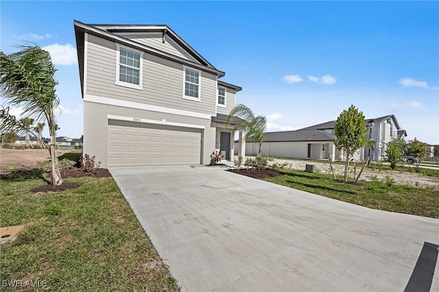 17251 Monte Isola Way N, Fort Myers, FL 33917 - view of front facade featuring an attached garage, concrete driveway, and stucco siding