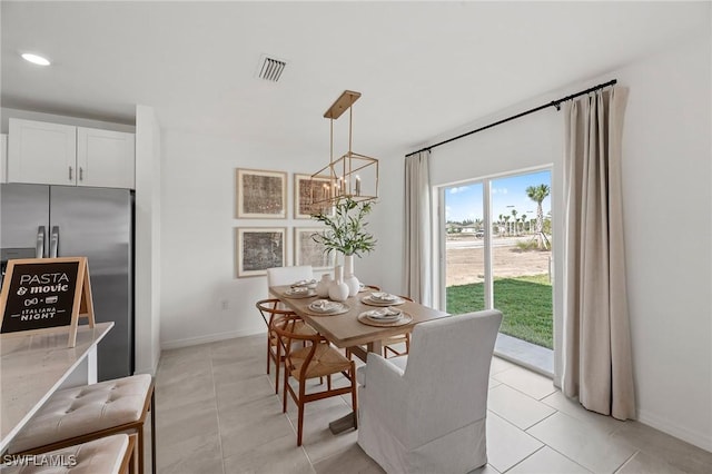 17251 Monte Isola Way N, Fort Myers, FL 33917 - dining area with a chandelier and light tile patterned floors