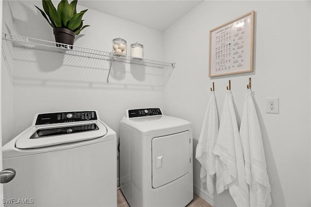 17251 Monte Isola Way N, Fort Myers, FL 33917 - washroom with washing machine and dryer and tile patterned flooring