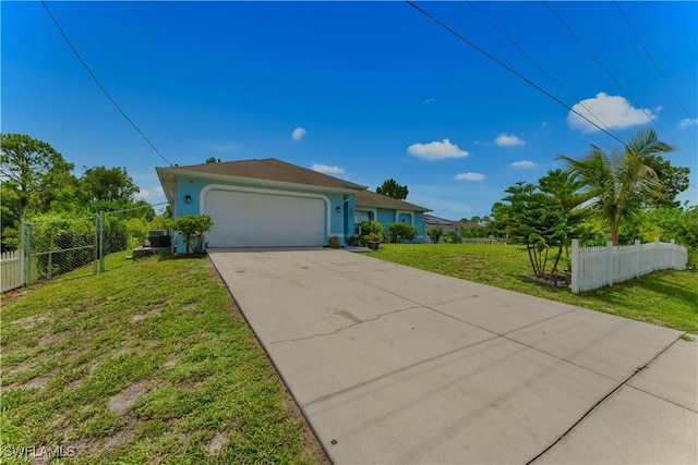 4402 Ruth Ave S, Lehigh Acres, FL 33976 - view of front of property with a garage, concrete driveway, and stucco siding