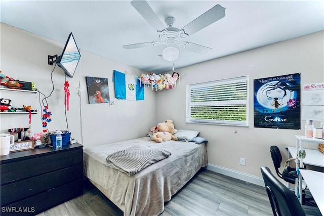 4402 Ruth Ave S, Lehigh Acres, FL 33976 - bedroom with wood finished floors and ceiling fan