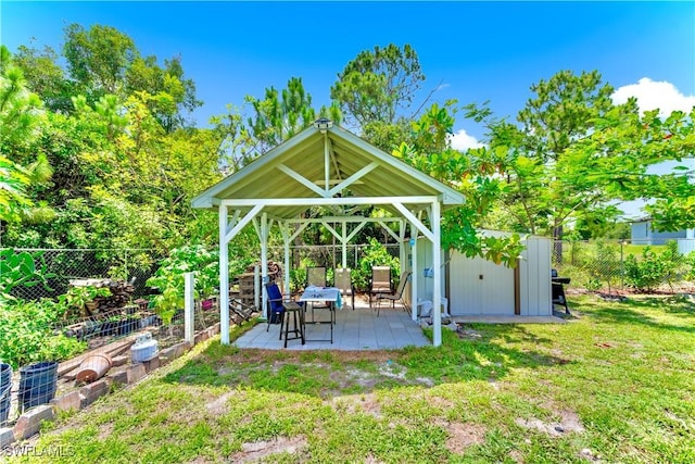 4402 Ruth Ave S, Lehigh Acres, FL 33976 - fenced backyard featuring a gazebo, a shed, and a patio area