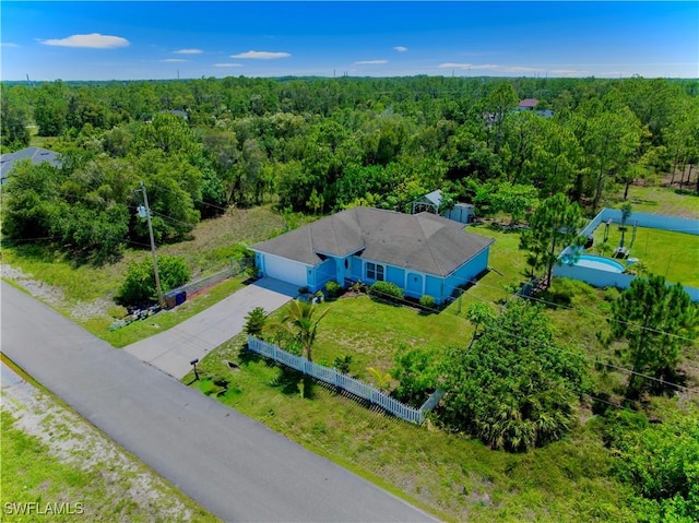 4402 Ruth Ave S, Lehigh Acres, FL 33976 - view from above of property with a forest
