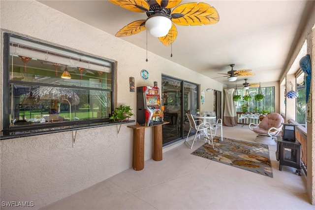 116 Sharwood Dr, Naples, FL 34110 - sunroom with a textured wall and a wood stove