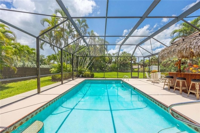 116 Sharwood Dr, Naples, FL 34110 - swimming pool featuring a patio area, a lawn, and a lanai