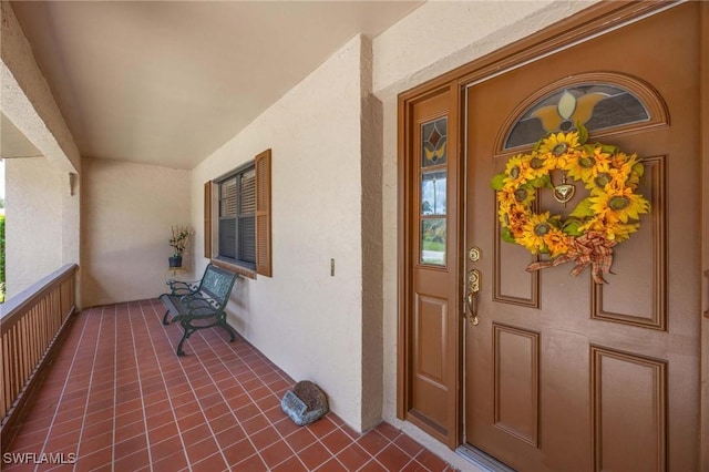 116 Sharwood Dr, Naples, FL 34110 - entrance to property with stucco siding and covered porch