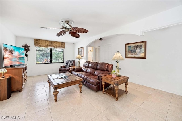 116 Sharwood Dr, Naples, FL 34110 - living area with a ceiling fan, arched walkways, and light tile patterned floors