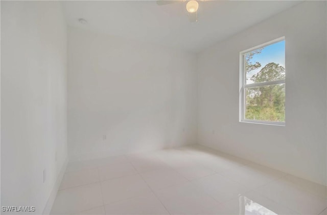 2613 73rd St W, Lehigh Acres, FL 33971 - empty room featuring light tile patterned flooring and a ceiling fan