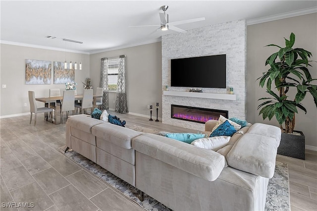 19368 Elston Way, Estero, FL 33928 - living room with ceiling fan, ornamental molding, and a stone fireplace