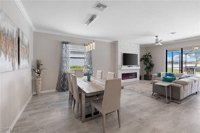 19368 Elston Way, Estero, FL 33928 - dining area with ornamental molding, a fireplace, and ceiling fan
