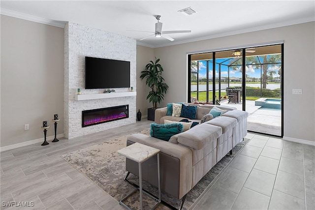 19368 Elston Way, Estero, FL 33928 - living room with a ceiling fan, crown molding, and a stone fireplace