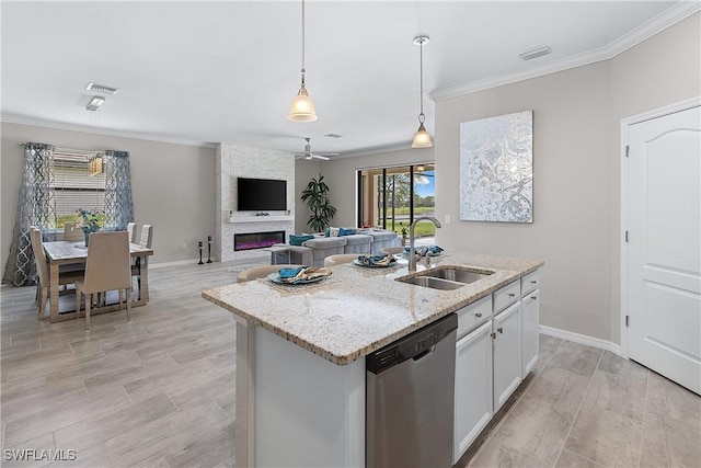 19368 Elston Way, Estero, FL 33928 - kitchen featuring stainless steel dishwasher, ornamental molding, ceiling fan, pendant lighting, and light stone counters