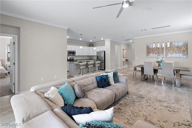 19368 Elston Way, Estero, FL 33928 - living area featuring a ceiling fan, recessed lighting, crown molding, and light wood-style floors
