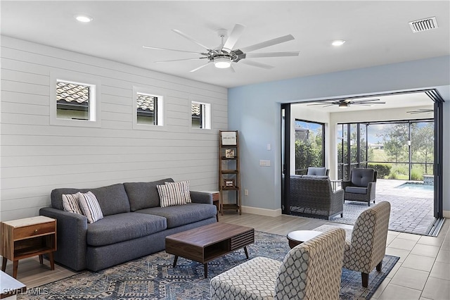 19387 Elston Way, Estero, FL 33928 - living room with ceiling fan, recessed lighting, and wood walls