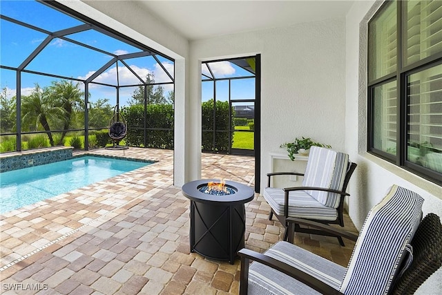 19387 Elston Way, Estero, FL 33928 - outdoor pool featuring a patio area, a fire pit, and a lanai