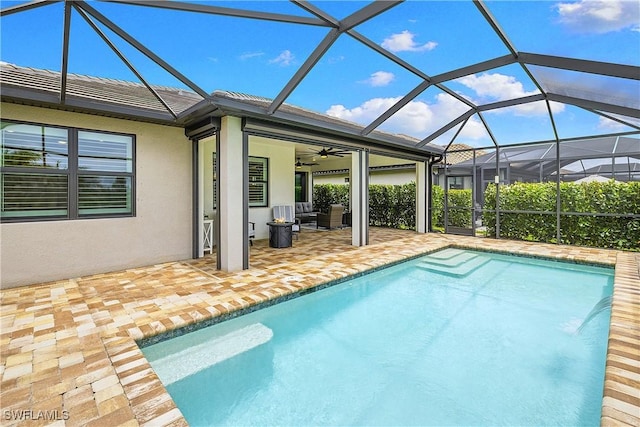 19387 Elston Way, Estero, FL 33928 - swimming pool with a patio area, ceiling fan, an outdoor hangout area, and glass enclosure