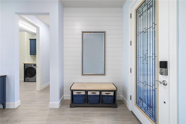 19387 Elston Way, Estero, FL 33928 - entryway featuring washer / dryer and wood walls