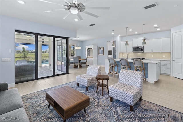 19387 Elston Way, Estero, FL 33928 - living area with a ceiling fan and recessed lighting