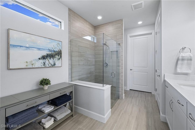 19387 Elston Way, Estero, FL 33928 - full bath featuring a shower stall, vanity, wood finished floors, and recessed lighting