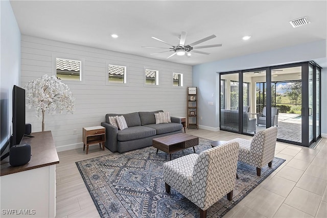 19387 Elston Way, Estero, FL 33928 - living area with ceiling fan, recessed lighting, and wooden walls