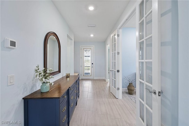 19387 Elston Way, Estero, FL 33928 - hall featuring french doors and baseboards