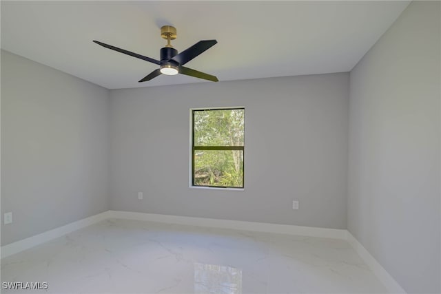 3709 6th St SW, Lehigh Acres, FL 33976 - unfurnished room featuring marble finish flooring and a ceiling fan