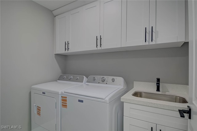 3709 6th St SW, Lehigh Acres, FL 33976 - laundry area featuring independent washer and dryer and cabinet space