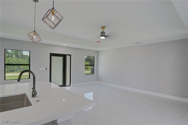 3709 6th St SW, Lehigh Acres, FL 33976 - kitchen with pendant lighting, light marble finish floors, open floor plan, ceiling fan, and recessed lighting