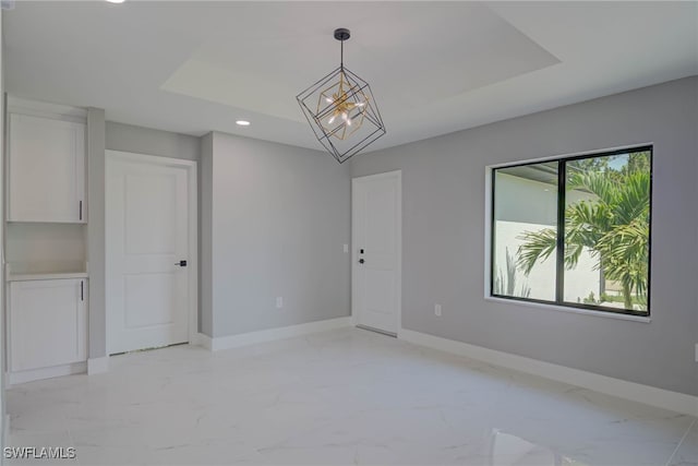 3709 6th St SW, Lehigh Acres, FL 33976 - empty room featuring light marble finish flooring, recessed lighting, and a chandelier
