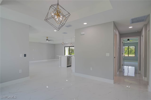 3709 6th St SW, Lehigh Acres, FL 33976 - spare room featuring healthy amount of natural light, recessed lighting, and light marble finish flooring