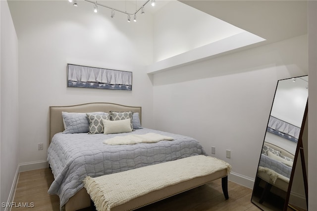 28871 Bermuda Lago Ct Unit 304, Bonita Springs, FL 34134 - bedroom featuring wood finished floors and a towering ceiling