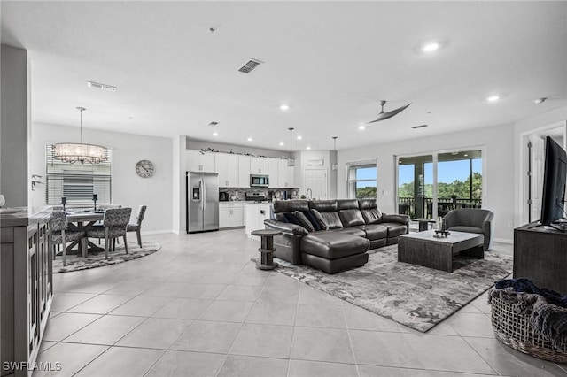 43301 Water Bird Way Unit 5221, Punta Gorda, FL 33982 - living area with a chandelier, light tile patterned floors, and recessed lighting