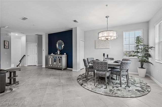43301 Water Bird Way Unit 5221, Punta Gorda, FL 33982 - dining area featuring a chandelier and light tile patterned flooring