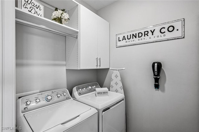43301 Water Bird Way Unit 5221, Punta Gorda, FL 33982 - laundry room with cabinet space and washing machine and clothes dryer