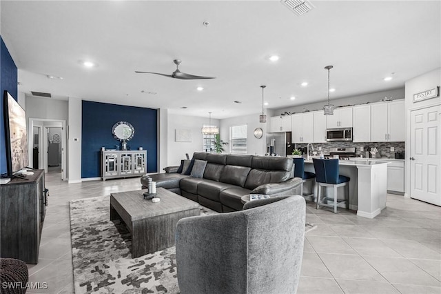 43301 Water Bird Way Unit 5221, Punta Gorda, FL 33982 - living area featuring a ceiling fan, light tile patterned floors, recessed lighting, and a chandelier