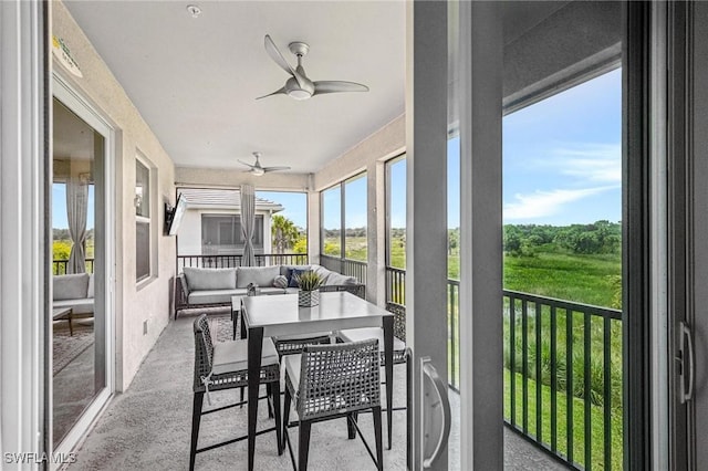 43301 Water Bird Way Unit 5221, Punta Gorda, FL 33982 - sunroom with ceiling fan and outdoor lounge area