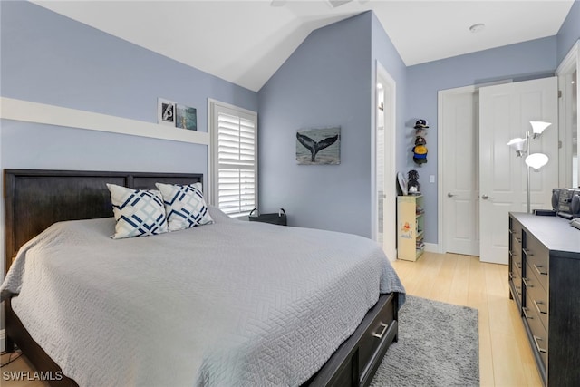 4323 Silver Fox Dr, Naples, FL 34119 - bedroom featuring light wood-type flooring and lofted ceiling