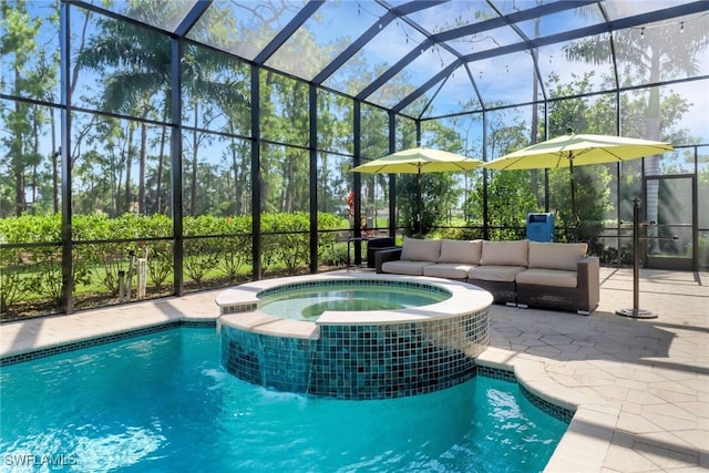 4323 Silver Fox Dr, Naples, FL 34119 - view of swimming pool with a pool with connected hot tub, glass enclosure, a patio, and outdoor lounge area