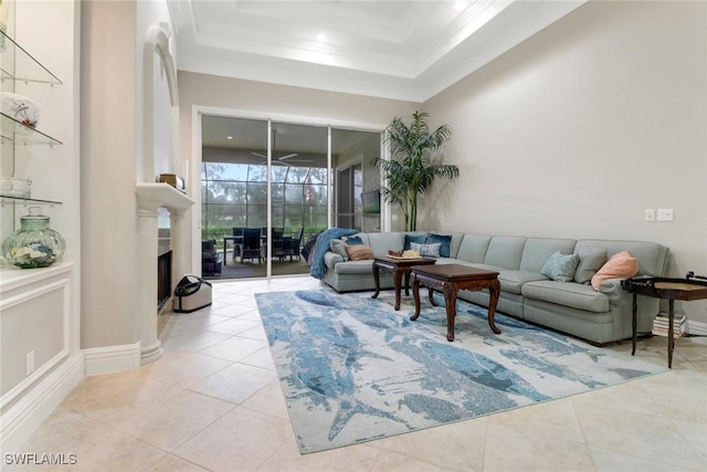 4323 Silver Fox Dr, Naples, FL 34119 - living area featuring crown molding, light tile patterned floors, and a raised ceiling