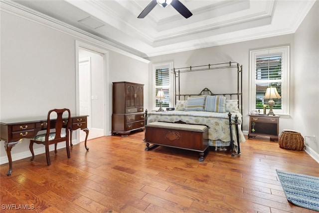 4323 Silver Fox Dr, Naples, FL 34119 - bedroom with a raised ceiling, light wood-type flooring, crown molding, and ceiling fan