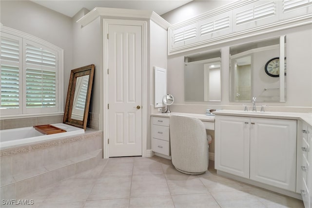 4323 Silver Fox Dr, Naples, FL 34119 - bathroom featuring vanity, a garden tub, and tile patterned flooring