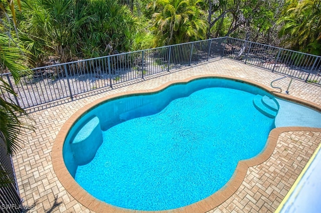 1674 Bunting Ln, Sanibel, FL 33957 - view of swimming pool featuring a patio