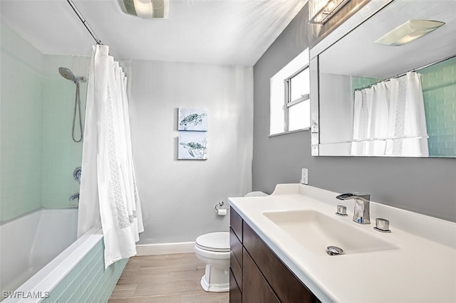 1674 Bunting Ln, Sanibel, FL 33957 - bathroom with vanity, shower / bath combo with shower curtain, and wood finished floors