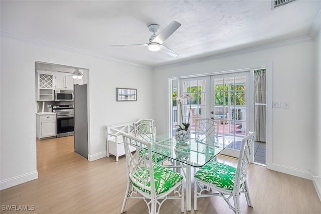 1674 Bunting Ln, Sanibel, FL 33957 - dining space with a ceiling fan, ornamental molding, light wood-style floors, and french doors