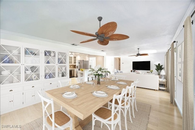 1674 Bunting Ln, Sanibel, FL 33957 - dining space featuring ceiling fan and light wood-style flooring
