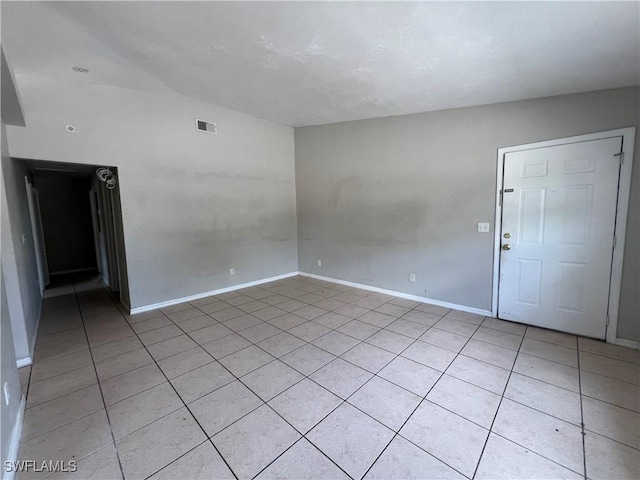 4869/4871 Leonard Blvd S, Lehigh Acres, FL 33973 - spare room with light tile patterned flooring and baseboards