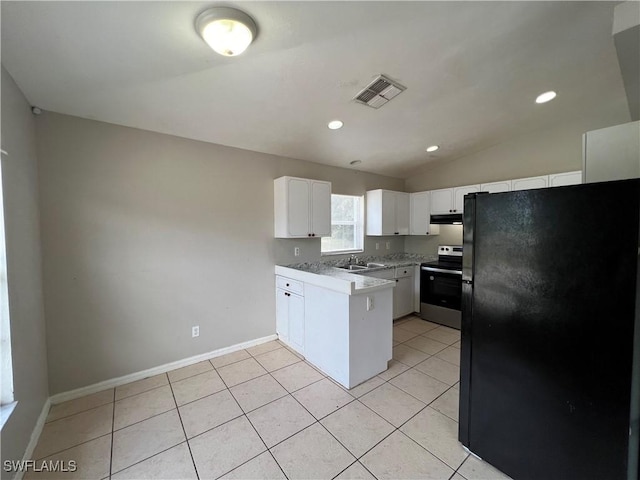 4869/4871 Leonard Blvd S, Lehigh Acres, FL 33973 - kitchen featuring stainless steel electric range oven, freestanding refrigerator, a peninsula, white cabinets, and lofted ceiling