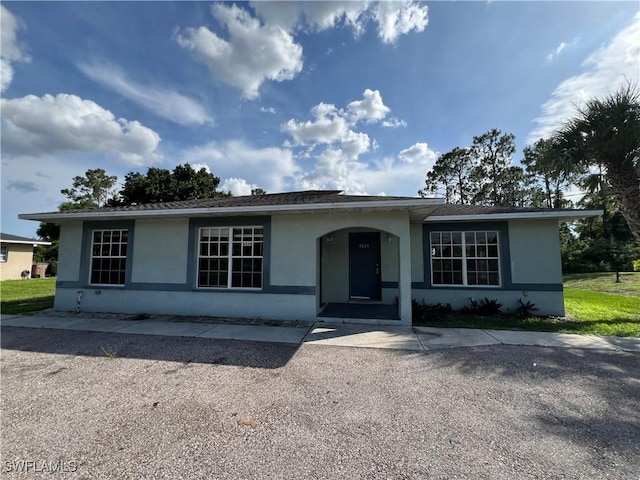 4869/4871 Leonard Blvd S, Lehigh Acres, FL 33973 - single story home with stucco siding