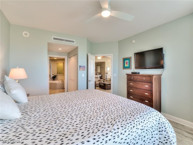 4182 Bay Beach Ln Unit 761, Fort Myers Beach, FL 33931 - bedroom featuring wood finished floors, ensuite bath, a closet, and a ceiling fan