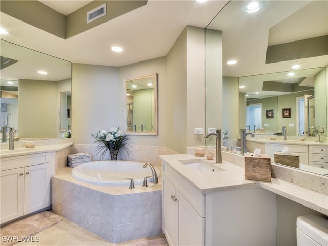 4182 Bay Beach Ln Unit 761, Fort Myers Beach, FL 33931 - bathroom with two vanities, a bath, recessed lighting, and tile patterned flooring